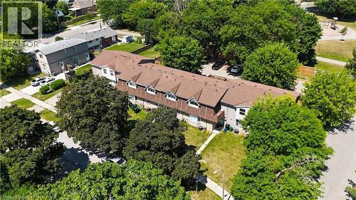 Townhome row with brown shingled roofs and dormer windows - 136 Jansen Avenue, Kitchener, ON - Outdoor With View