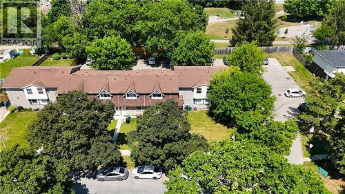 Townhouse complex featuring a multi-gabled roofline and individual entryways - 136 Jansen Avenue, Kitchener, ON - Outdoor