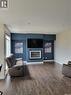 718 Patrick Bay, Saskatoon, SK  - Indoor Photo Showing Living Room With Fireplace 