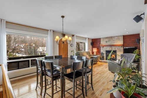 Dining Room - 174 Rue Des Deux-Montagnes, Bromont, QC - Indoor Photo Showing Dining Room With Fireplace