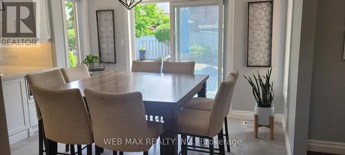 Breakfast area combined with family room - 22 Ashbury Crescent, Caledon, ON - Indoor Photo Showing Dining Room