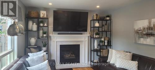 gas fireplace - 22 Ashbury Crescent, Caledon, ON - Indoor Photo Showing Living Room With Fireplace