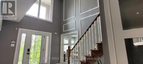 new double door entry to living room - 22 Ashbury Crescent, Caledon, ON - Indoor Photo Showing Other Room