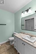 Well-appointed main bath with modern vanity and tub surround. - 