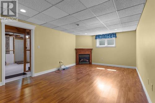 Cozy lower level family room with propane fireplace. - 21 Westbrook Landing, Mount Pearl, NL - Indoor