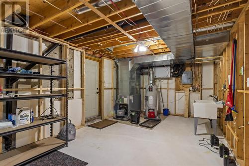 Clean utility room with excellent storage and workshop space. - 21 Westbrook Landing, Mount Pearl, NL - Indoor Photo Showing Basement