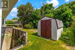 Storage shed provides plenty of room for tools and seasonal items. - 