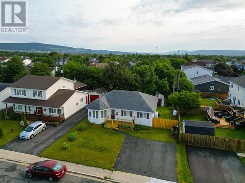 Front aerial showcasing the home, mature surroundings, and welcoming curb appeal. - 21 Westbrook Landing, Mount Pearl, NL - Outdoor