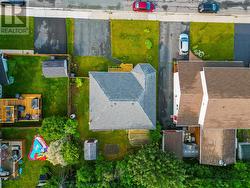 Aerial perspective overlooking the backyard and neighbouring homes. - 