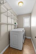 Spacious main floor laundry with abundant built-in storage. - 
