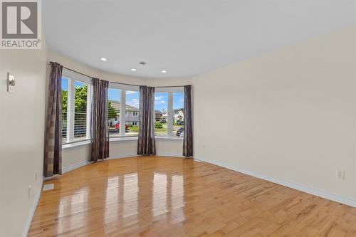 Sun filled living room featuring beautiful hardwood flooring and a large Bay Window. - 21 Westbrook Landing, Mount Pearl, NL - Indoor Photo Showing Other Room