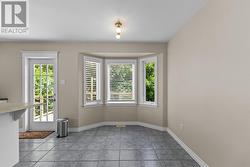 Eat-In dining area overlooking the private backyard. - 