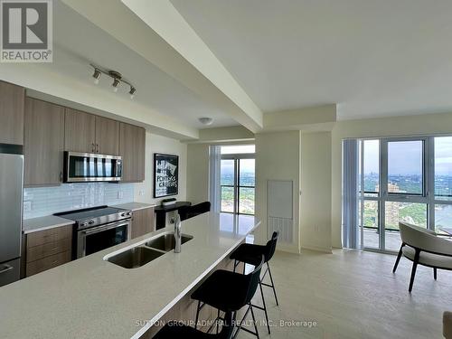 Ph102 - 38 Annie Craig Drive, Toronto, ON - Indoor Photo Showing Kitchen With Double Sink