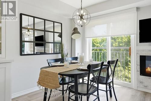 12 - 39 Panabaker Drive, Hamilton, ON - Indoor Photo Showing Dining Room With Fireplace