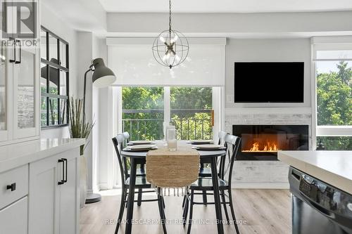 12 - 39 Panabaker Drive, Hamilton, ON - Indoor Photo Showing Dining Room With Fireplace