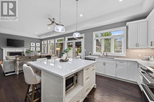 14 Mayapple Crescent, Middlesex Centre (Ilderton), ON - Indoor Photo Showing Kitchen With Fireplace With Upgraded Kitchen