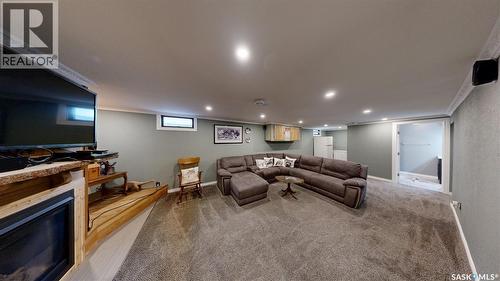 128 Riddell Crescent, Regina, SK - Indoor With Fireplace