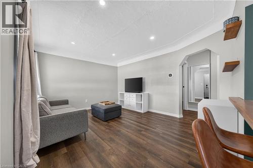 Living area featuring wood-finish flooring, recessed lighting, and a neutral color palette - 621 Tate Avenue, Hamilton, ON - Indoor