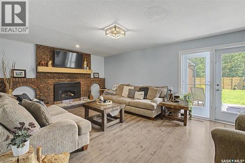 1791 Barton Drive, Prince Albert, SK - Indoor Photo Showing Living Room With Fireplace