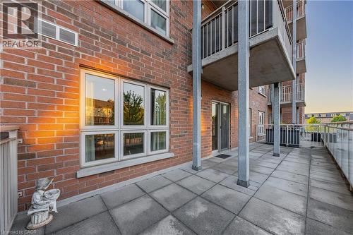 Spacious outdoor patio featuring durable paver flooring - 155 Water Street S Unit# 203, Cambridge, ON - Outdoor With Exterior