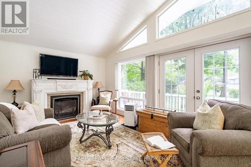 33 Oneida Crescent, Tiny, ON - Indoor Photo Showing Living Room With Fireplace