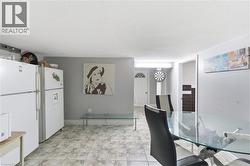 Tiled flooring with a neutral pattern extends throughout the space - 