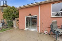Rear exterior featuring a sliding glass door for patio access - 