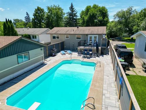 54 Darrach Bay, Brandon, MB - Outdoor With In Ground Pool With Deck Patio Veranda