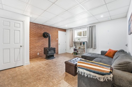 Salle familiale - 2110 10E Rue, Saint-Georges, QC - Indoor Photo Showing Living Room With Fireplace