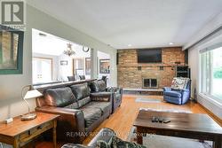 Living room has an open wall into the kitchen. - 