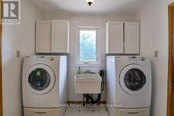 Main floor laundry is off the kitchen. - 
