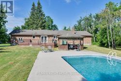 Rear view of the home; pool rebuilt in 2019. - 