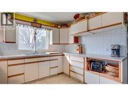 Cupboard on right spaced for dishwasher. - 