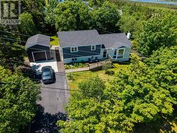 Front of house with private 0.5+ acre treed lot - 
