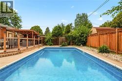 In-ground swimming pool with a concrete surround - 