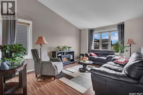 412 Lyle Crescent, Warman, SK - Indoor Photo Showing Living Room With Fireplace