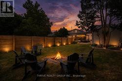 AI edited - cozy backyard fire in the firepit - 