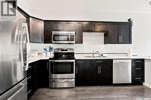 214 545 Hassard Close, Saskatoon, SK - Indoor Photo Showing Kitchen With Stainless Steel Kitchen With Double Sink