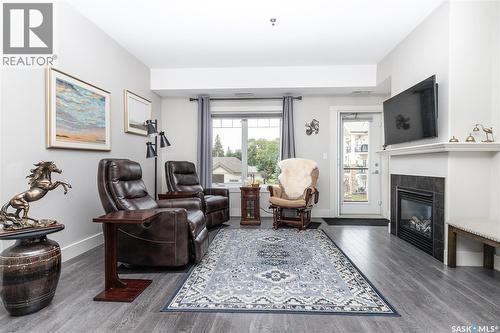 217 1010 Ruth Street E, Saskatoon, SK - Indoor Photo Showing Living Room With Fireplace