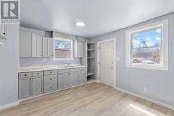 Front door, walks into kitchen . - 