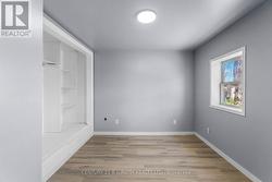 Bedroom with built-in storage shelving - 