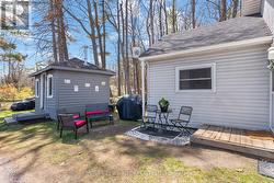 Main house with storage shed beside & sitting area - 