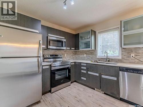 143 135 Ashworth Crescent, Saskatoon, SK - Indoor Photo Showing Kitchen With Double Sink With Upgraded Kitchen