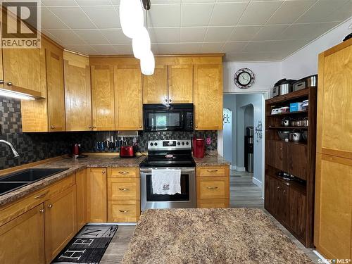 124 Taylor Street, Kamsack, SK - Indoor Photo Showing Kitchen With Double Sink