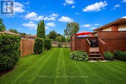 Fully fenced backyard with large deck - 