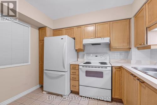 216 - 115 Bonis Avenue, Toronto, ON - Indoor Photo Showing Kitchen With Double Sink