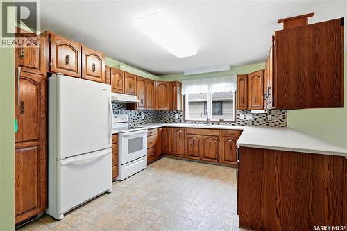 705 Main Street, Rosetown, SK - Indoor Photo Showing Kitchen With Double Sink