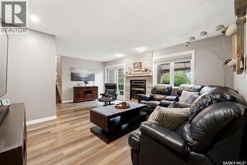 18 Forman Bay, Regina, SK - Indoor Photo Showing Living Room With Fireplace