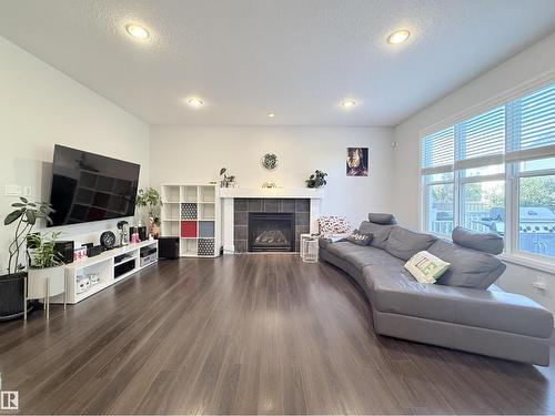 5876 168 Av Nw, Edmonton, AB - Indoor Photo Showing Living Room With Fireplace