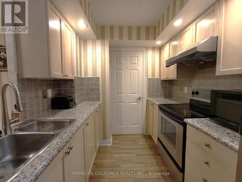 720 - 33 Cox Boulevard, Markham, ON - Indoor Photo Showing Kitchen With Double Sink